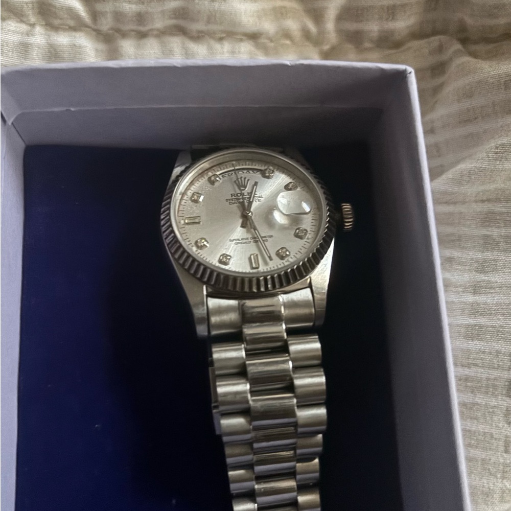 Rolex Silver Timepiece with Gem Accents